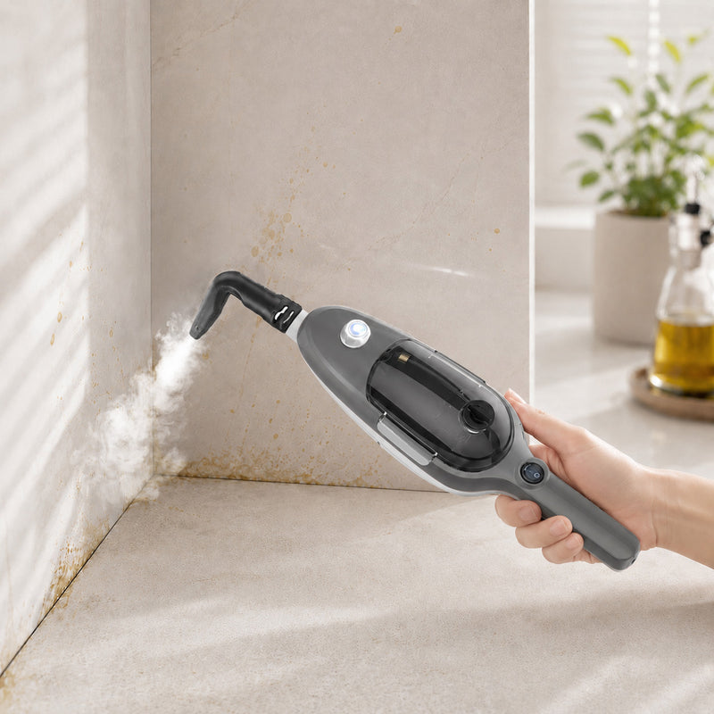 Gray steam cleaner nozzle cleaning a kitchen